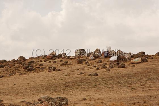 IMG_6805-Edit.jpg - rocks and boulders on a hillside with graffiti painted on them