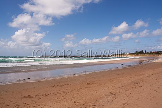 IMG_6923-Edit.jpg - Boats behind wall in distant harbour on the coast of Australia